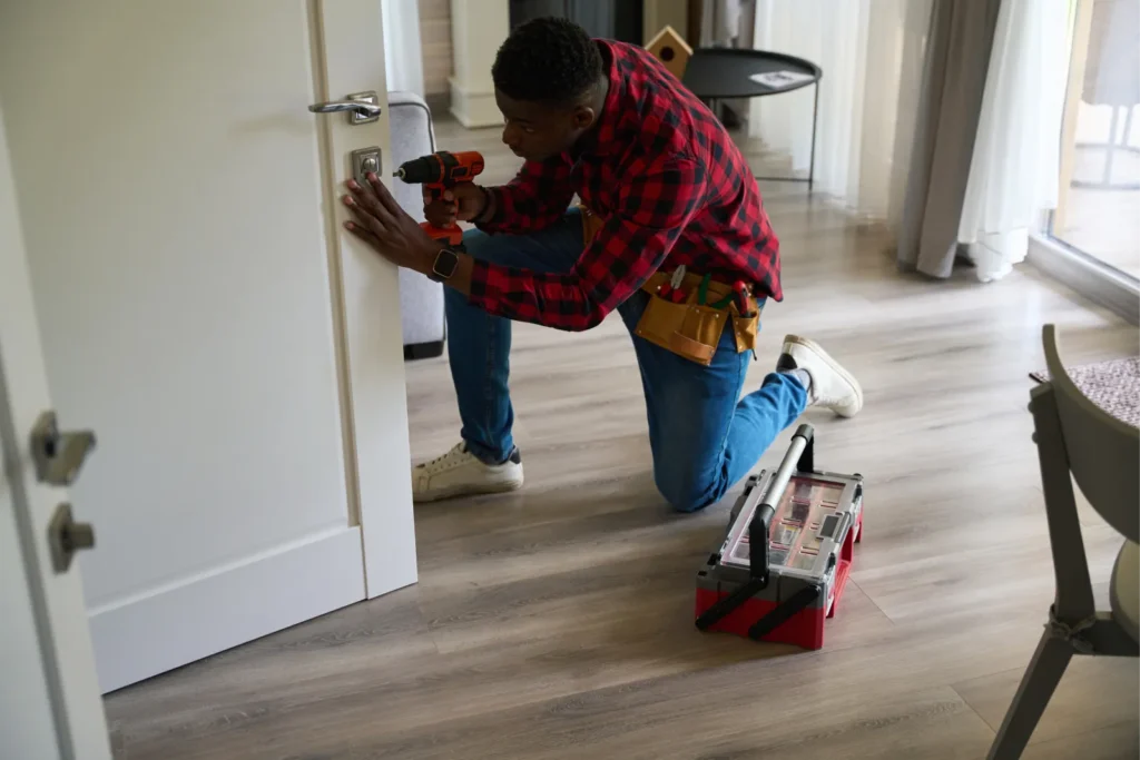 locksmith repairing a door lock in BTM Layout Bengaluru